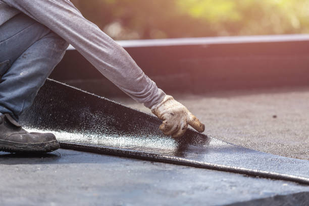 Professional Basement Waterproofing technician working in Greenville, PA